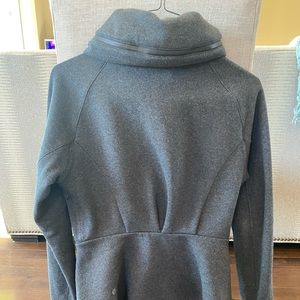 Fleece jacket with zipper hidden rain hood, in excellent shape.